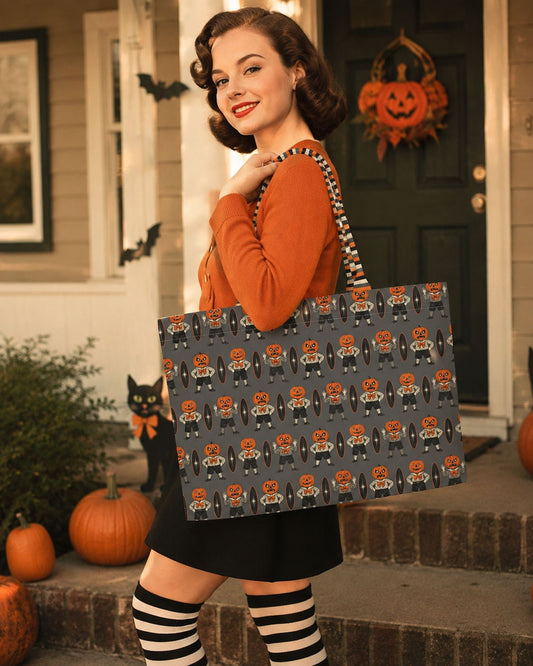 Everyday luxe tote bag on shoulder with Halloween character pattern and striped fabric handles