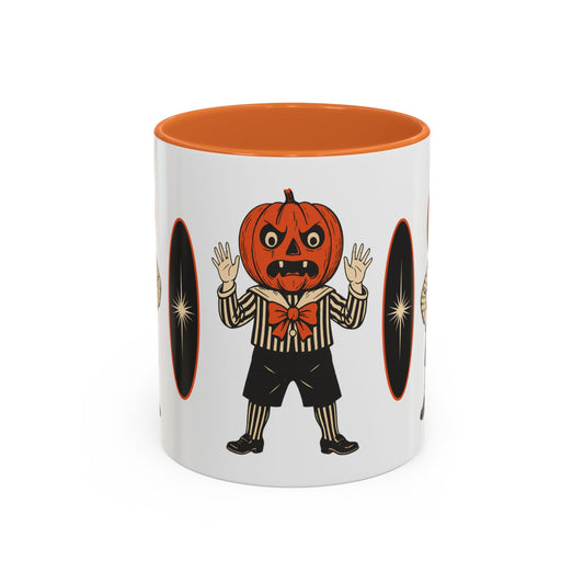 Vintage Halloween coffee mug with orange interior and jack-o-lantern character print