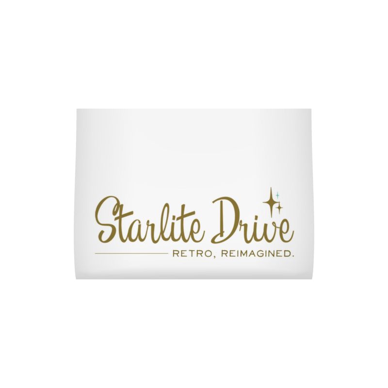 Tea towel label reading “Starlite Drive” and “RETRO, REIMAGINED” in gold text