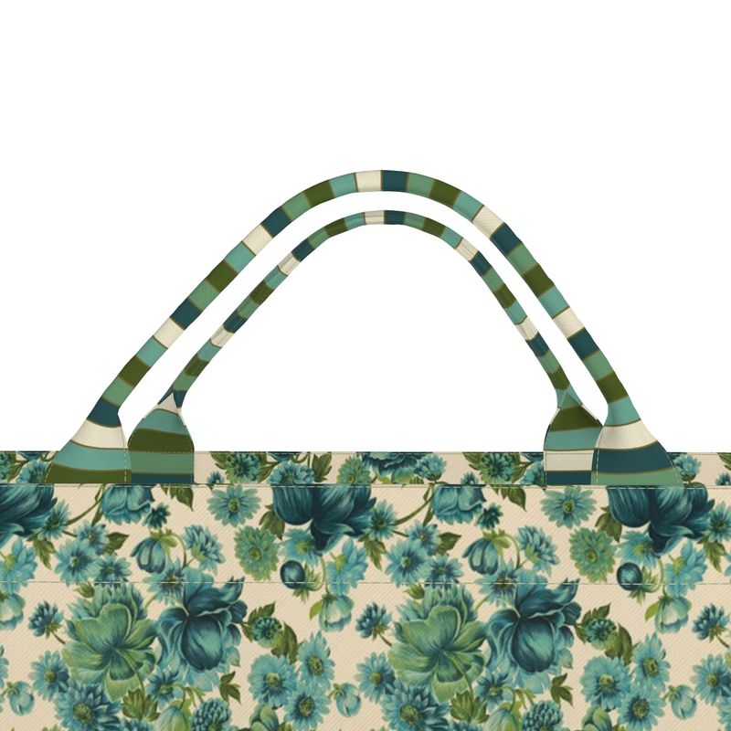 Top view of floral tote bag with striped handles and teal leaf print trim