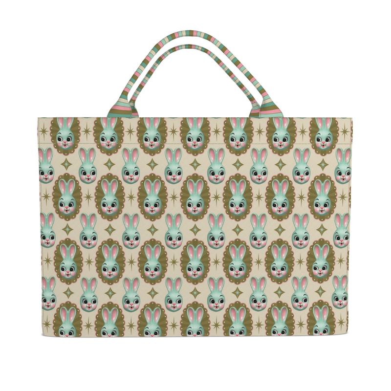 Cream tote bag with repeating mint bunny faces and brown star accents, striped handles