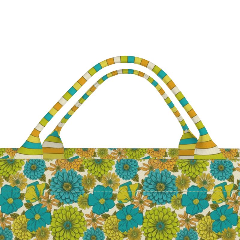 Tote bag handles with striped fabric over blue and green floral top edge