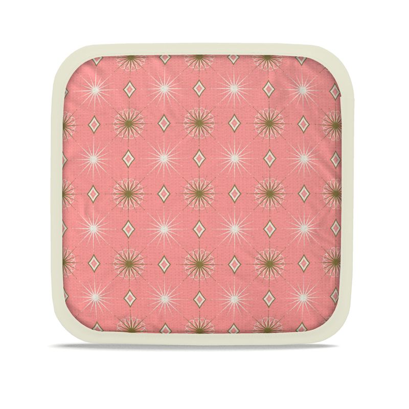 Square pink hot plate holder with starburst and diamond pattern, cream edge trim