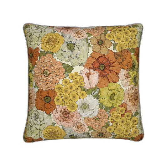 Floral decorative pillow with multicolor flowers, light background, and dark green piping