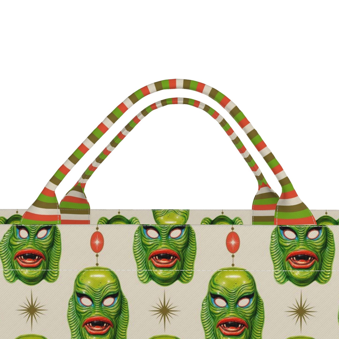 Printed monster tote bag with green-striped handles, close view