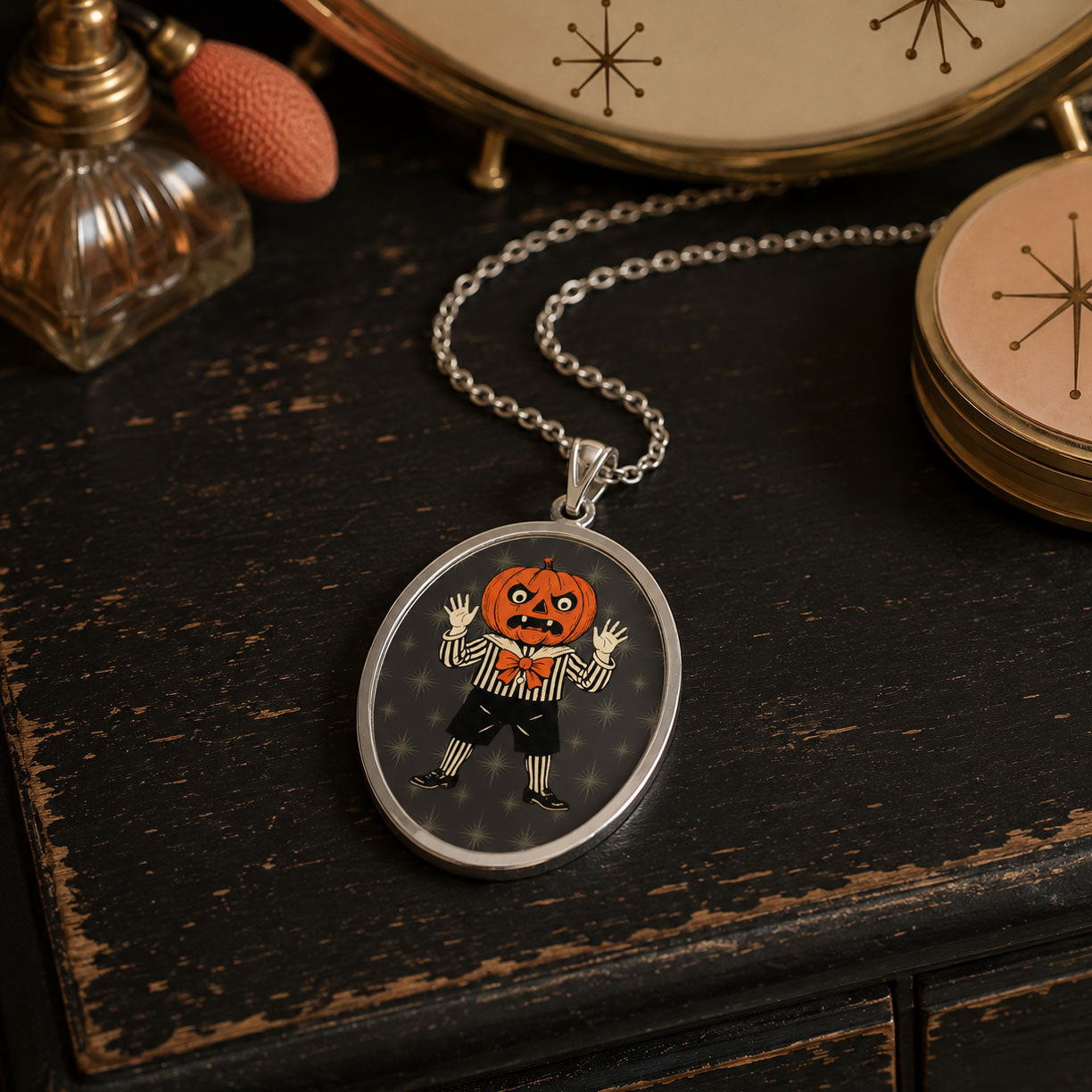 Jolly Jack oval pendant necklace with silver chain and Halloween jack character charm