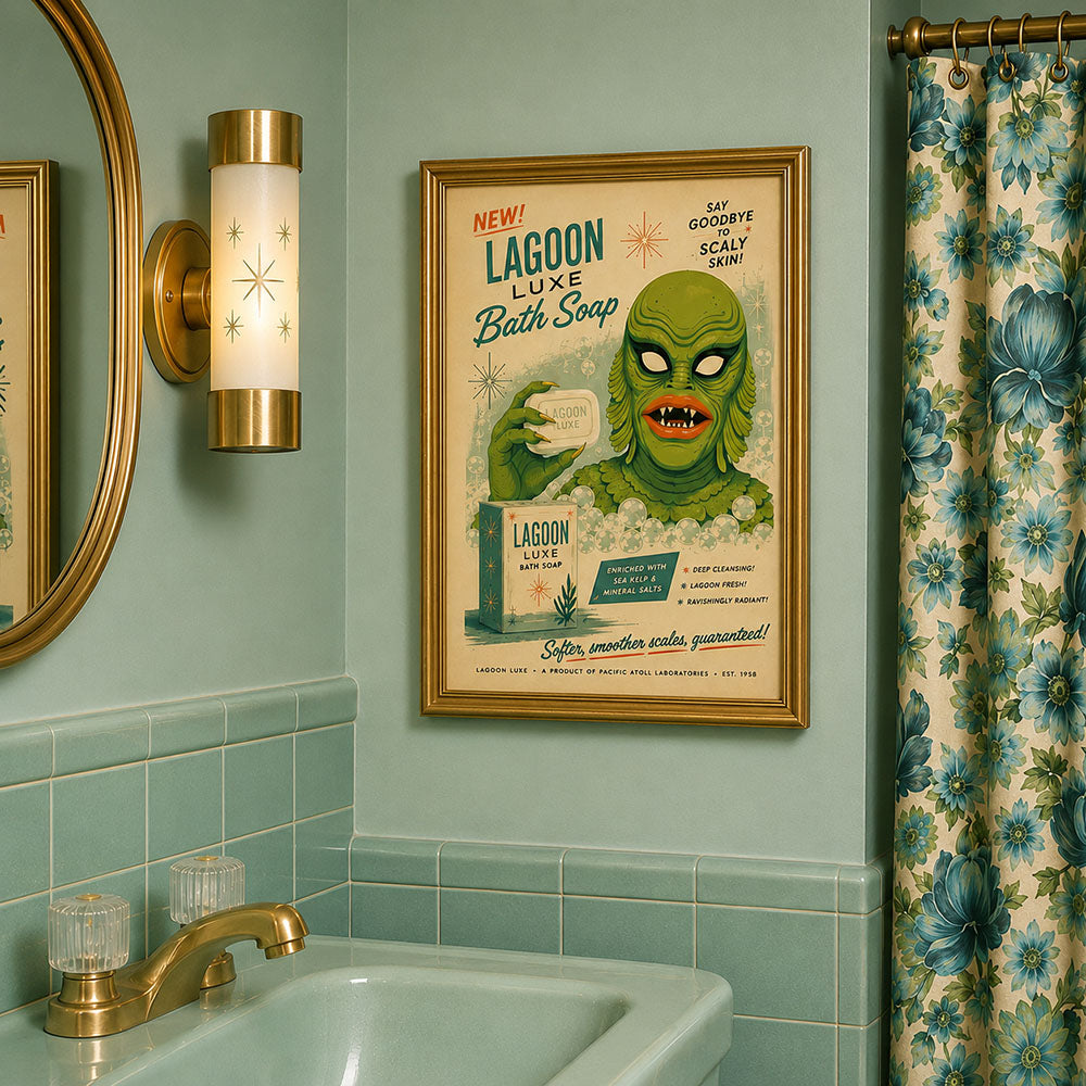 Gold-framed Lagoon Luxe bath soap art print on bathroom wall with green monster