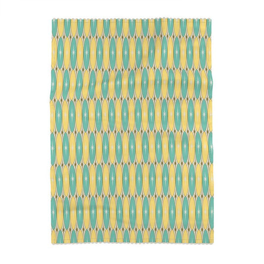 Rectangular teal and gold tea towel with repeating oval pattern, full view