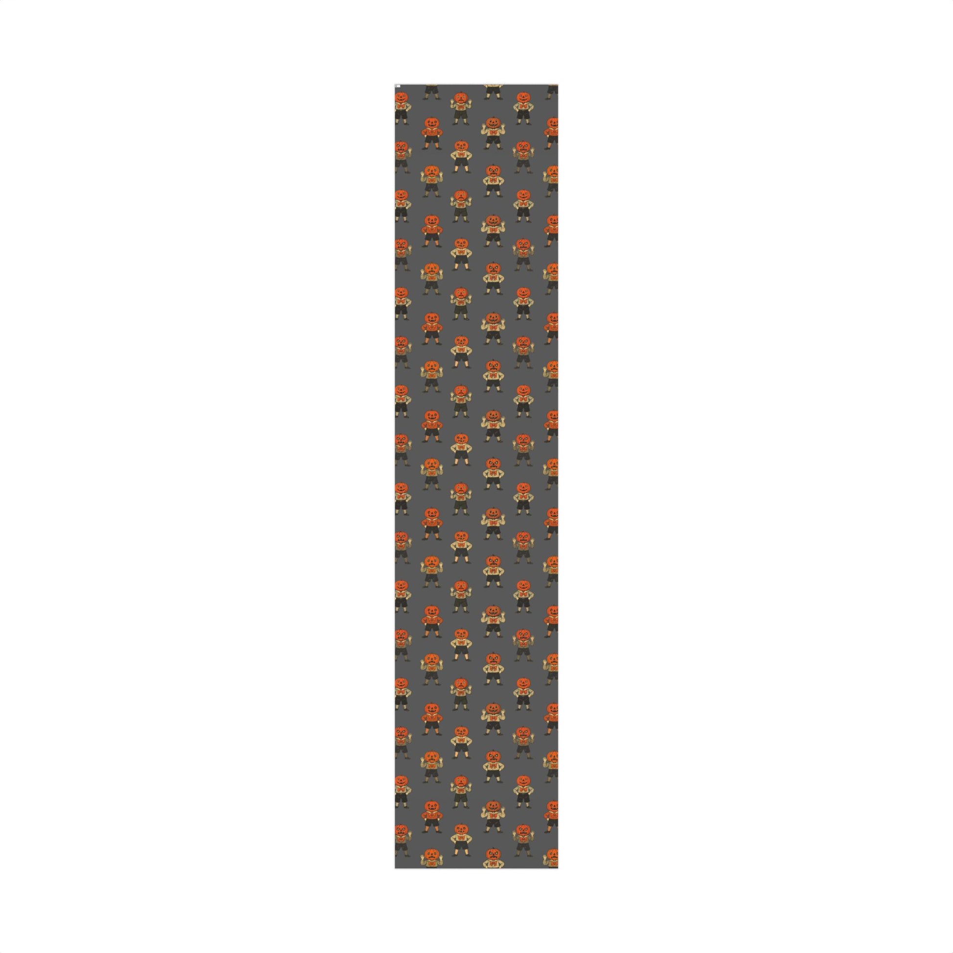Narrow roll strip of vintage jack-o'-lantern wrapping paper with repeating orange kids