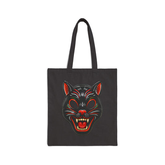 Black tote bag with a graphic of a vintage black cat halloween mask on a white background